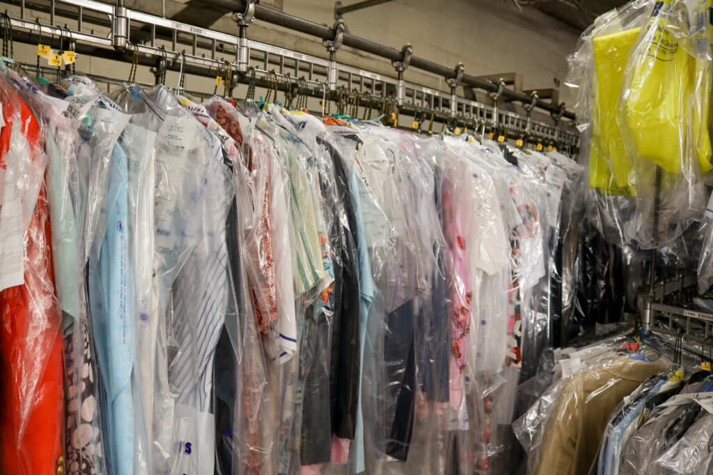 Garments on dry cleaning conveyor system