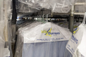 Dry cleaner packaging logo on men's shirt on clothing hangers