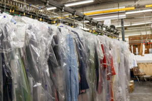 Clothing on garment conveyor at dry cleaning store