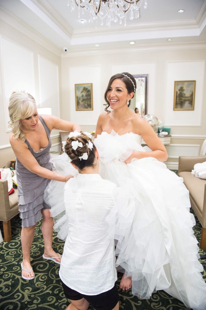 bride in wedding dress with bridesmaid